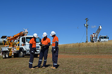 Crews repairing a pole