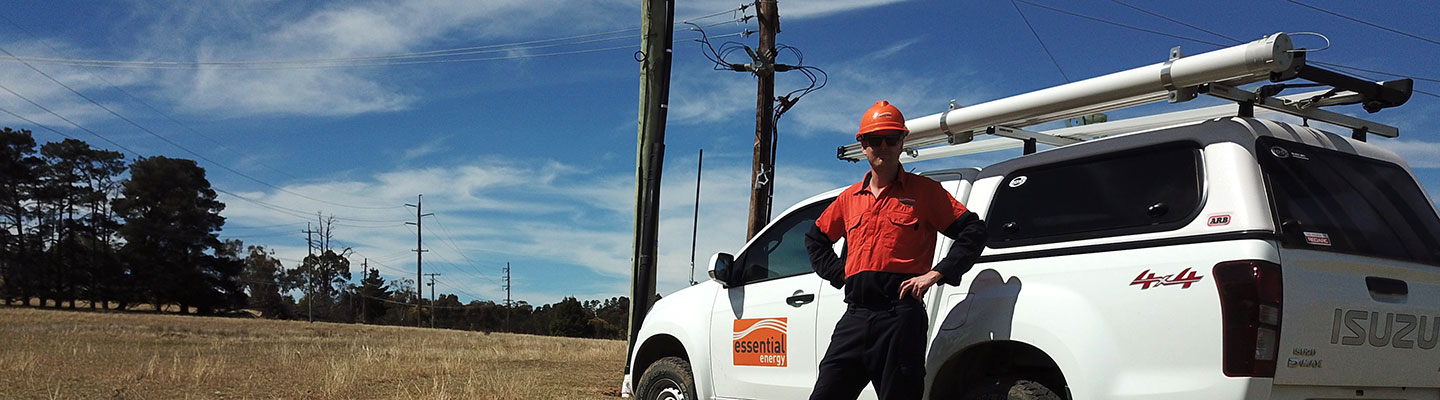 Worker in field with truck