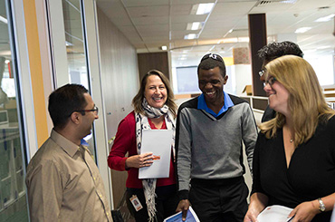 Staff walking through an office