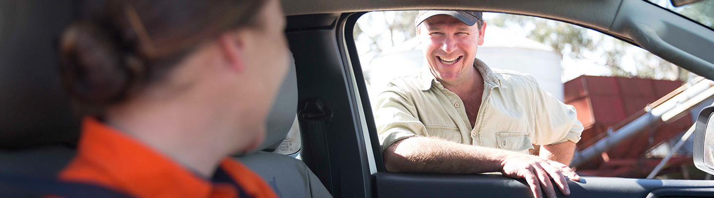 Farmer smiling through truck window