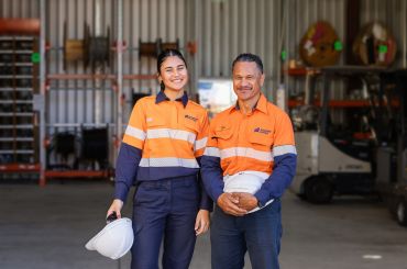 Two people smiling at camera