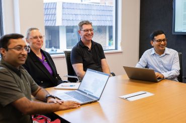 Four people in an office