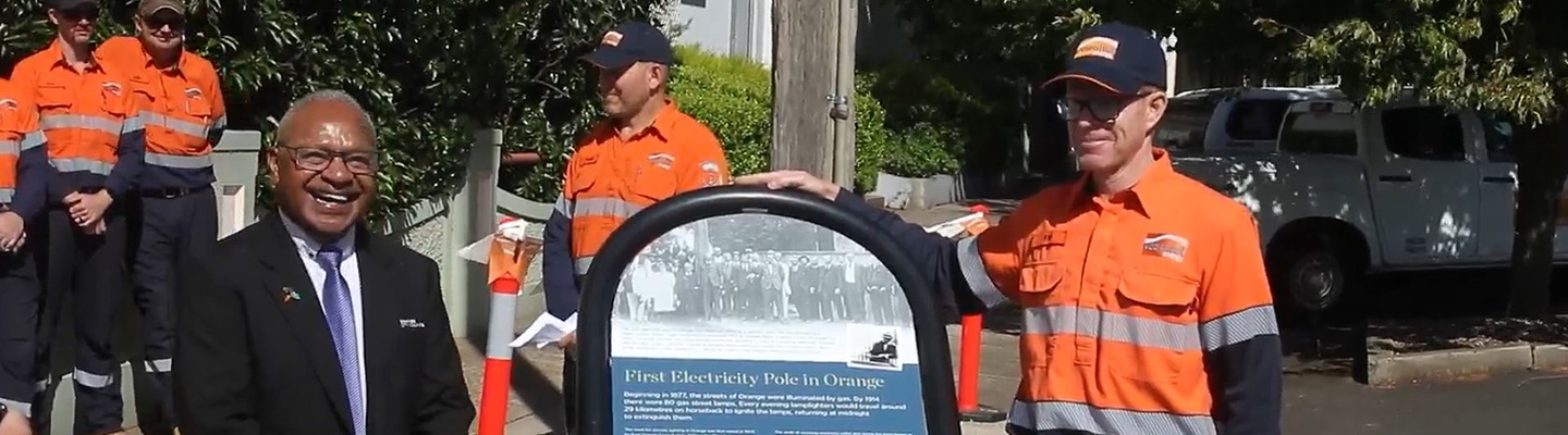 People standing near sign