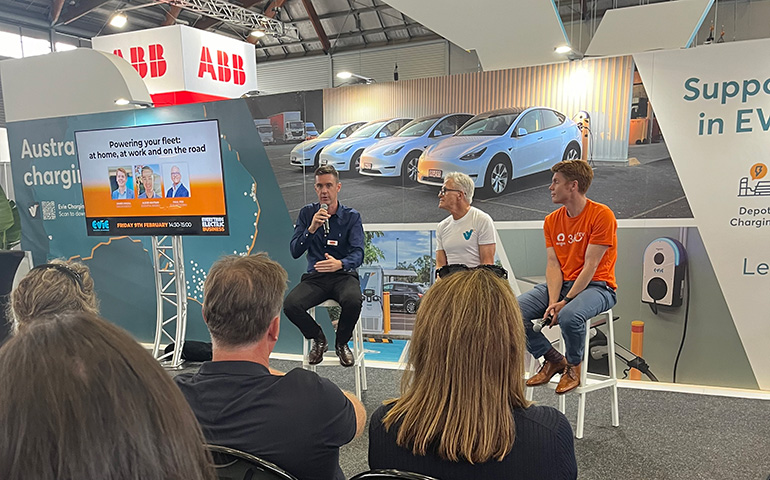3 panel members discussing electric vehicles