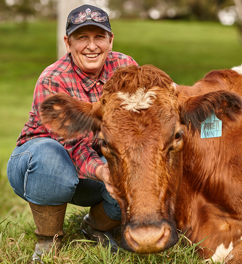 Dairy farmer and cow