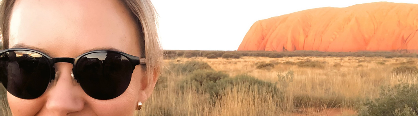 Hannah with Uluru in background