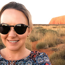 Hannah with Uluru in background