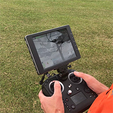 Worker holding a drone controller