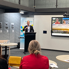 John Cleland presenting at UNE