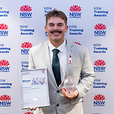 Jack holding his award and trophy