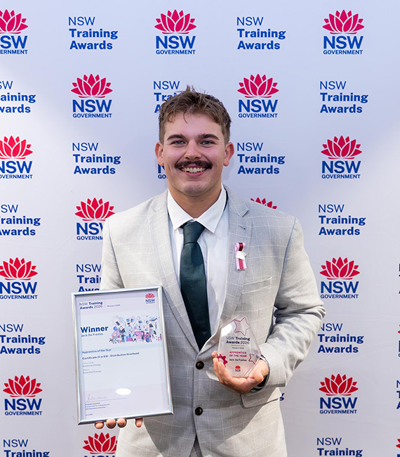 Jack holding his award and trophy