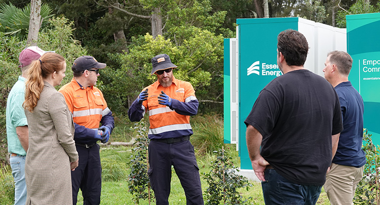 People standing near a community battery