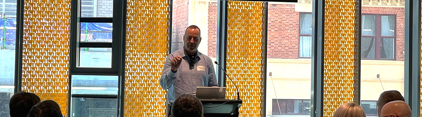 Michael Mills presenting to a group of people