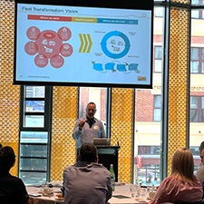 Michael Mills presenting to a group of people