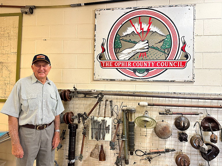 Roy Buss in front of Ophir County Council artefacts