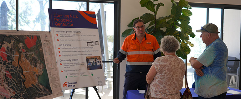 Worker explaining plans on a chart to two people