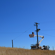 Crews working near a pole