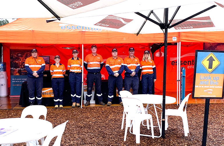 Essential Energy employees standing in front of a display at Primex