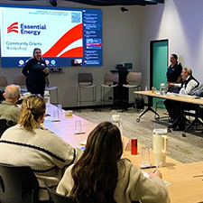 Employee discussing with community members