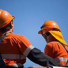 Workers with blue sky background