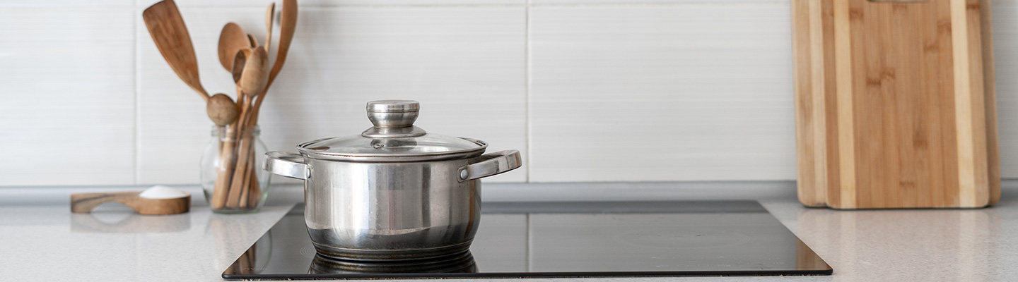 Induction cooktop with wooden utensils