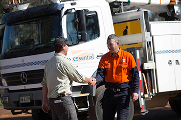 Worker and customer shaking hands