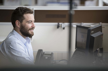Office worker in front of computer