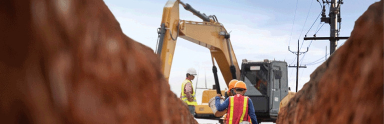 Workers digging in a trench