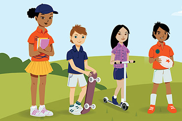 Four kids standing on a green hill